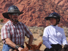 Load image into Gallery viewer, Equestrian trail riders on horseback. Male wearing the Da Brim Equestrian Endurance Helmet Brim Visor in gray. Female is wearing the Da Brim Rezzo helmet visor in black.