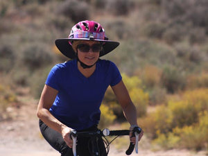 Female road cyclist wearing the Da Brim Sporty Cycling Helmet Visor Brim in pastel ribbons