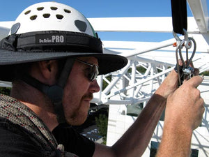 Rigger wearing the Da Brim PRO Tech Construction Helmet Visor Brim in gray while on the jobsite.