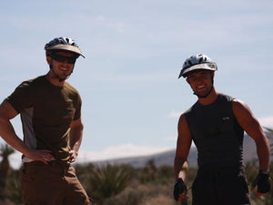 Two mountain bikers wearing the Da Brim Rezzo helmet visor.