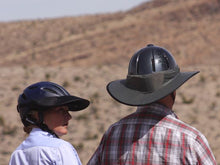 Load image into Gallery viewer, Two Trail riders. Female is wearing the Da Brim Rezzo helmet visor and male is wearing the Da Brim Equestrian Endurance helmet brim visor in gray.