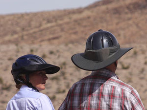 Two Trail riders. Female is wearing the Da Brim Rezzo helmet visor and male is wearing the Da Brim Equestrian Endurance helmet brim visor in gray.