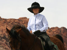 Load image into Gallery viewer, Female rider on a horse. Rider is wearing the Da Brim Equestrian Petite Helmet Brim Visor in black.