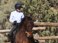 Load image into Gallery viewer, Woman practicing Dressage in an outdoor ring. She is wearing the Da Brim Rezzo helmet visor