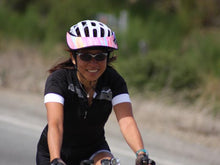 Load image into Gallery viewer, Female road biker riding with a Da Brim Rezzo helmet visor in pastel ribbons.