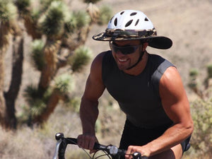 Male road cyclist pictured riding in the desert with a Da Brim Sporty Cycling Helmet Visor Brim.