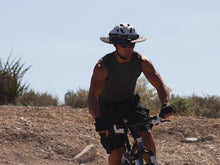 Load image into Gallery viewer, Mountain biker going downhill wearing the Da Brim Sporty Cycling Helmet Visor Brim