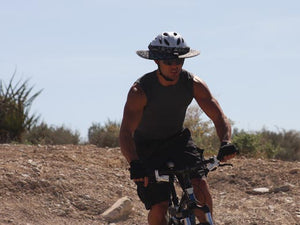 Mountain biker going downhill wearing the Da Brim Sporty Cycling Helmet Visor Brim